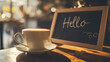 © kazakova0684 - Coffee cup and chalkboard with hello text on table in cafe
