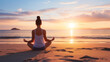 © kazakova0684 - Silhouette of young woman practicing yoga on the beach at sunset
