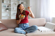 © Prostock-studio - Happy young asian woman enjoying fresh salad bowl at home