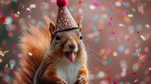 A Close Up Of A Squirrel Wearing A Party Hat With Confetti On It's Head And Sticking Its Tongue Out.