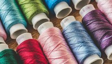 Background Of Sewing Threads Of Different Colors Pink Blue Green Red