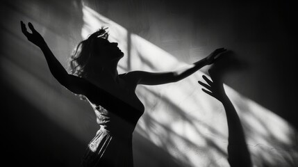 A graceful dancer radiates pure joy as she raises her arms to the beat of the music, casting a mesmerizing shadow in her elegant dress at a concert