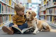 Therapy for children. A little boy reads to dog in the library. Photo of child and animal friend helping him develop reading skills. Aimed at children with hearing impairments and disabilities