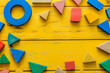 © Natali - Colorful math fractions on the wooden background. interesting math for kids, for preschool, daytime. Education, back to school concept. Geometry and mathematics materials. AI Generated