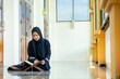 © maya1313 - Ramadan, The image of an Asian Muslim woman in the Islamic religion in hijab in black color. reading the Quran and having a happy smiling face Staying in a beautiful mosque out of respect for God.