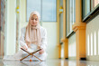 © maya1313 - Ramadan, quran, The image of an Asian Muslim woman in the Islamic religion in hijab in cream color. reading the Quran and having a happy Staying in a beautiful mosque, Arabic word Holy Al Quran.