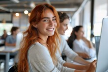 Radiant Young Redhead Lady Smiling At Her Workstation In An Office Environment
