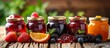 Assorted collection of glass jars filled with various fresh delicious fruits for homemade preserves and jams