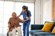 © Kawee - Asian young caregiver nurse examine senior woman patient at home.