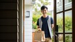 © Elchin Abilov - Young man delivering food to customer at doorway