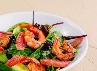 Wall Mural - Healthy fresh salad with shrimps, avocado and grapefruit