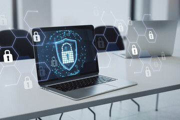 Poster - Laptop on a desk displaying a digital security shield amidst virtual lock icons. Data security concept