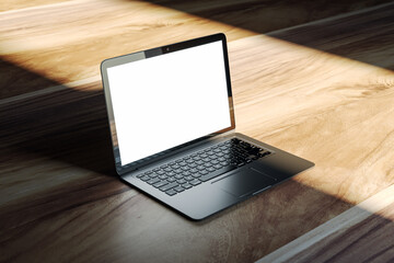 Poster - Sleek laptop mockup on wooden flooring with a soft, natural light casting shadows. 3D Rendering