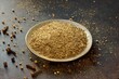 Garam masala - Indian dry seasoning, powder from a mixture of various spicy plants in a metal bowl on a dark background close-up.