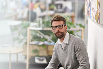 Office, business and portrait of man in creative workspace for career, job and working at startup company. Professional worker, entrepreneur and confident person with opportunity, pride and ambition