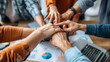 © Planetz - close up of hands holding hands,  team work in office