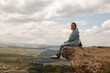 Woman on mountain cliff