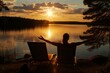 yoga pose on lounge chair, sun setting over lake