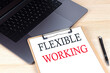 © Iryna - FLEXIBLE WORKING text written on a paper clipboard on laptop