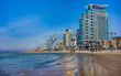 Tel Aviv beach with a view of Mediterranean sea and sea front hotels, Israel.