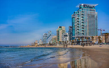 Wall Mural - Tel Aviv beach with a view of Mediterranean sea and sea front hotels, Israel.