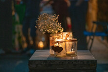 Tea Lights And Candles Arranged On A Wooden Table