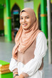 © Connect Images - A portrait of a young muslim woman outside her mosque in southern Thailand