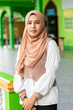 © Connect Images - A portrait of a young muslim woman outside her mosque in southern Thailand