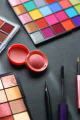 Canvas Print - Various colorful make up products on dark background. Selective focus.