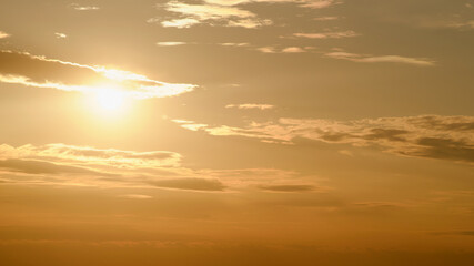 Wall Mural - Beautiful sunset in the sky background. Sky with clouds and sun