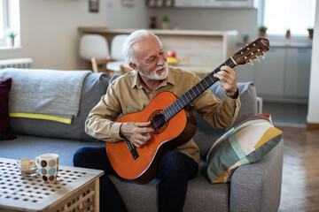 Man playing acoustic instrumental guitar playing new written song sound signing creative talented person.