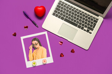 Canvas Print - Photo of beautiful woman with laptop, pen and hearts on purple background. Concept of online dating