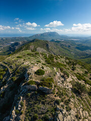 Aerial view of Castell d'Aixa and Castell de la Solana mountain ridge in a sunny blue sky, Lliber, Costa Blanca, Alicante, Spain - stock Photo