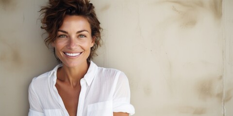 Poster - A woman wearing a white shirt smiles at the camera. This picture can be used for various purposes