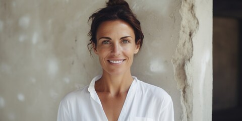 Aufkleber - A woman in a white shirt standing by a wall. Suitable for various concepts and themes