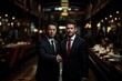 © Aleksandr - A European or American businessman shakes hands with a Chinese counterpart in a professional indoor setting.