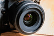Reflex camera or dslr with reflexion on lens, photograph equipment, for professionnal and agency