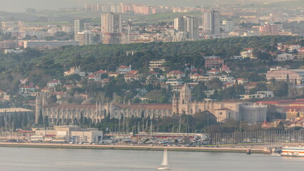 Wall Mural - Lisbon cityscape with Jeronimos Monastery and Emprie Square and park timelapse. Lisbon, Portugal