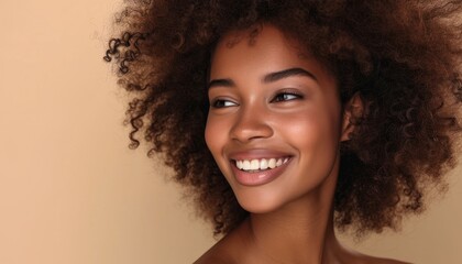 Wall Mural - Portrait of a smiling beautiful afro girl with clean healthy skin on beige background