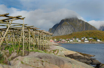 Wall Mural - Picturesque landscape on a fishing village with fish drier in Reine in Lofoten Islands, North Norway.