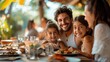 © Barosanu - Mand and woman parents with two children having lunch at terrace