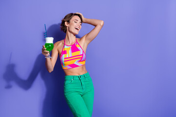 Poster - Photo of positive cute girl wear trendy clothes drink mojito alcohol enjoy summer party empty space isolated on purple color background