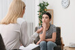 © New Africa - Psychologist working with teenage girl in office