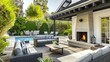 © neirfy - Cozy backyard or patio area with garden furniture, swimming pool and outdoor fireplace