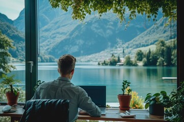 Poster - a man is sitting at a wooden desk placed in front of a large window, engaged in work or study, an it