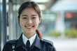 Asian woman wearing security guard or safety officer uniform on duty