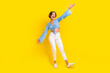 Full size photo of cheerful girl wear stylish blouse white pants hand up presenting black friday sale isolated on yellow color background