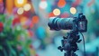 © Rattanathip - A professional DSLR camera mounted on a tripod, ready for a photo shoot with beautiful bokeh light in the background.