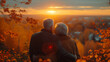 An elderly couple happily embracing while watching the sunset from the top of a mountain with a beautiful landscape. They represent health in old age