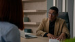 © Yuliia - Business meeting in office African American businessman employer HR manager consultant recruiter consulting customer hiring new employee job interview talking to client candidate recruit negotiation